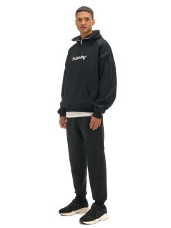 Cropp Spodnie*Czarne dresowe joggery z nadrukiem na nogawce czarny