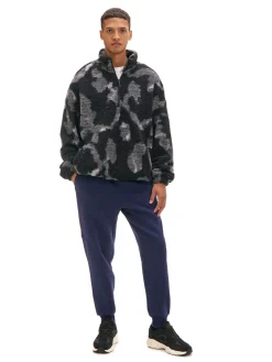 Cropp Spodnie*Granatowe dresowe joggery z nadrukiem na nogawce granatowy