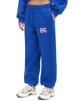 Cropp Spodnie|Sety*e dresowe joggery z naszywką niebieski